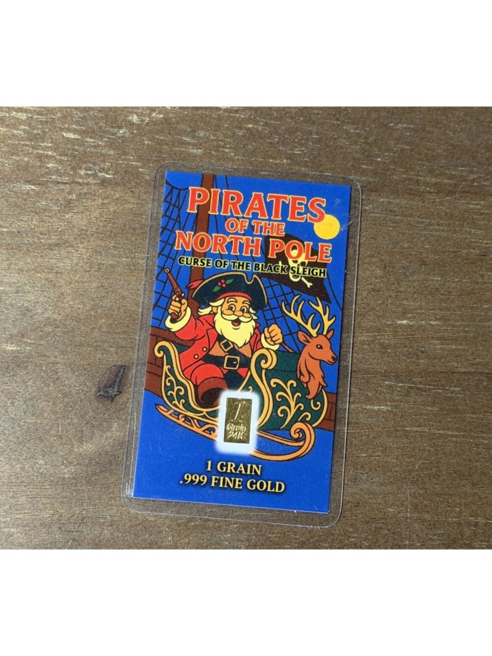 2025 Postal Express Mint Pirates of the North Pole 1 grain .999 gold bar card